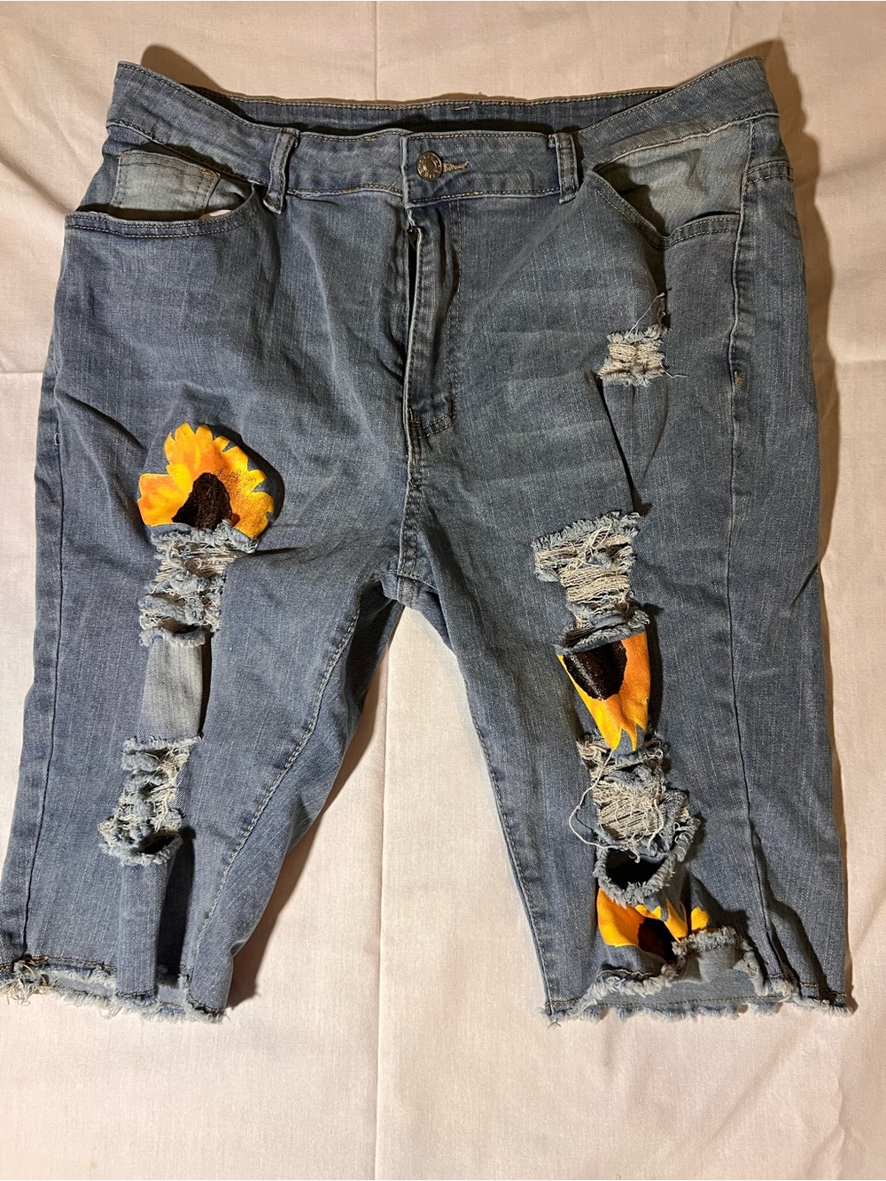 Distressed Blue Women’s Denim Jeans with Sunflower Patch